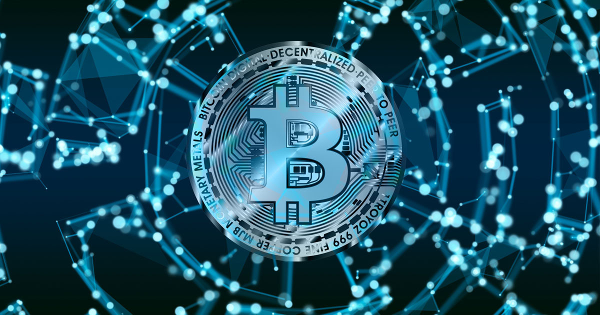 A blue and silver digital Bitcoin token surrounded by a glowing network grid representing blockchain security and crypto theft UAE recovery