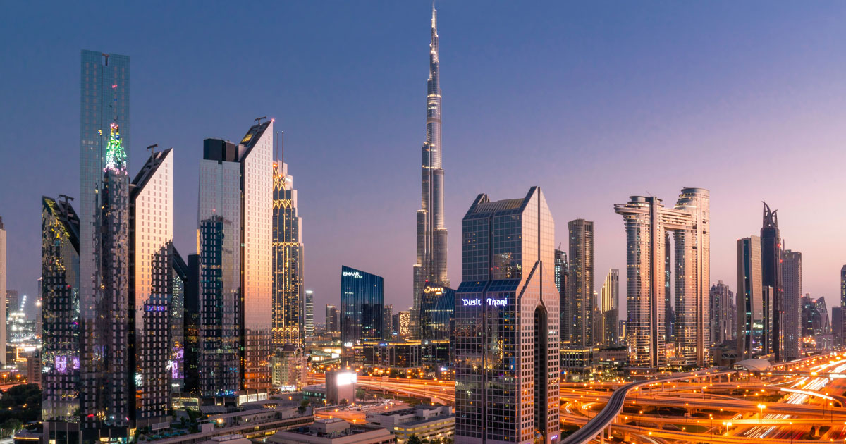 Dubai skyline featuring Burj Khalifa and illuminated skyscrapers representing cryptocurrency business environment and crypto business setup Dubai services